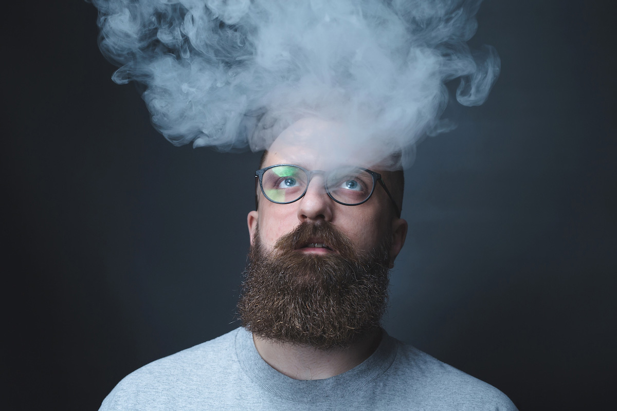 Man with smoke lingering above his head